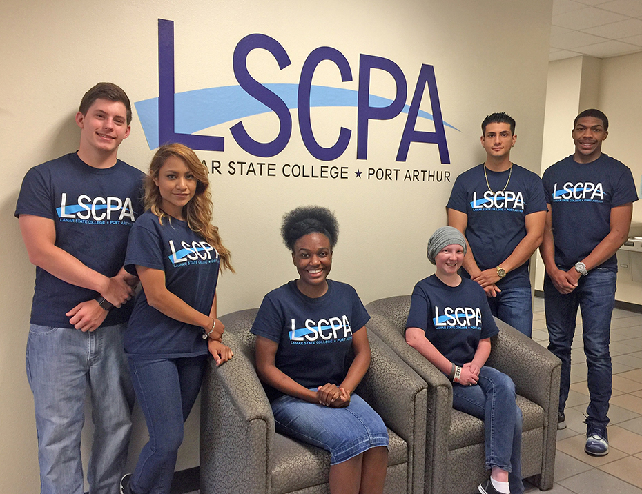 Student Government Officers, two seated in chairs and four standing in front of LSCPA logo on wall.