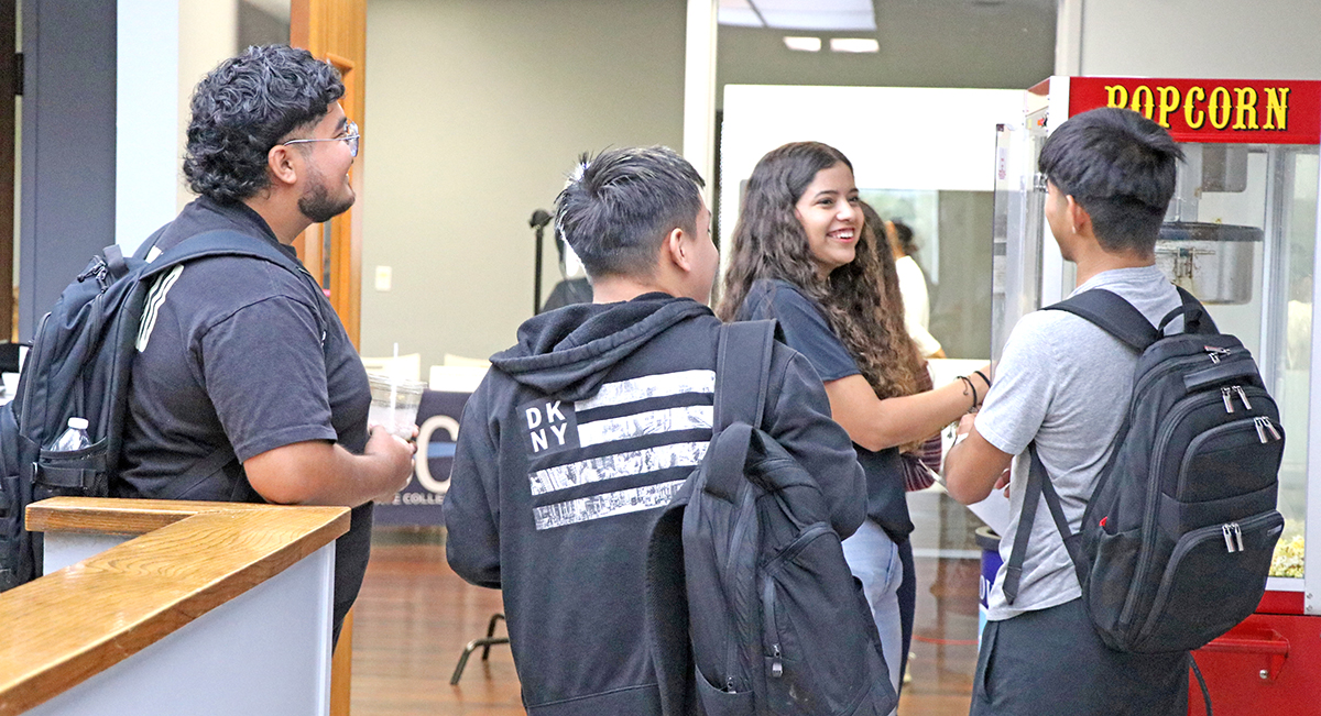 Students talking and smiling.