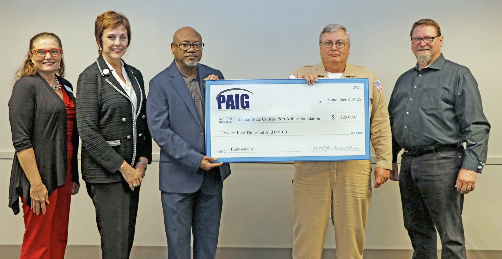 People with large donation check.